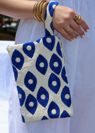 Evil eye design woven cotton clutch bags made in Greece. Blue eye design wristlets artisinal made in Greece fashion pouch
