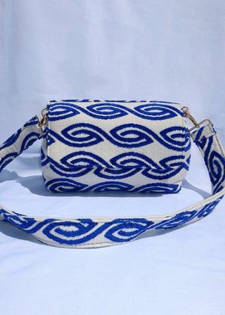 Handcrafted crossbody handbag made in Greece by artisan weavers using looms, this 100% cotton crossbody bag features a blue eye wave print design and gold hardware