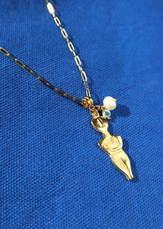 A gold-plated Cycladic figurine pendant necklace with an evil eye charm and a freshwater pearl on a chain made in Greece - Greek jewelry