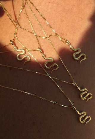 24k gold-plated python charm necklace on a gold chain by Greek designer jewelry brand Zenais, gold snake necklace made in Greece