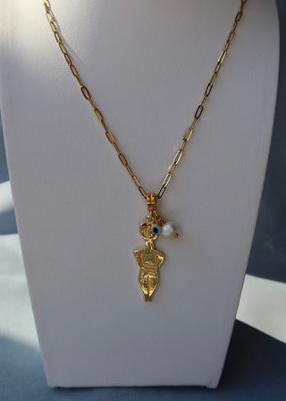A gold-plated Cycladic figurine pendant necklace with an evil eye charm and a freshwater pearl on a chain made in Greece - Greek jewelry