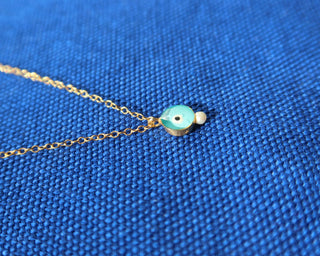 Turquoise glass evil eye necklace with a freshwater pearl accent. 14k gold-plated sterling silver 925 necklace handcrafted in Greece, Greek jewelry for protection, Greek designer brand