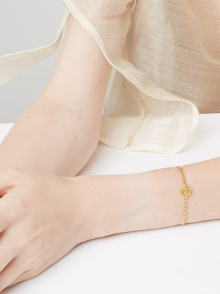 Gold-plated sterling silver Gourmet Chain Evil Eye Bracelet made in Greece - Greek jewelry by Barbora Jewelry at Aegean Essence. Gold chain bracelet on model