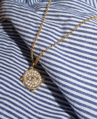 Handmade gold-plated silver 925 evil eye necklace with white pavé stones by Greek jewelry designer Barbora. Greek eye jewelry for protection.
