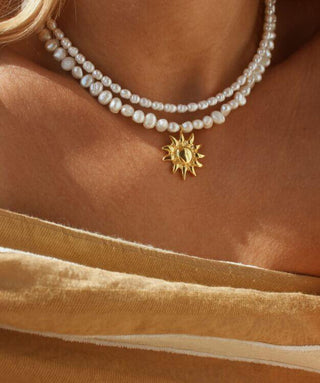 Freshwater pearl necklace with a gold sun pendant charm, necklace made in Greece, Greek jewelry, Greek designer brand, summer aesthetic jewelry made in Greece