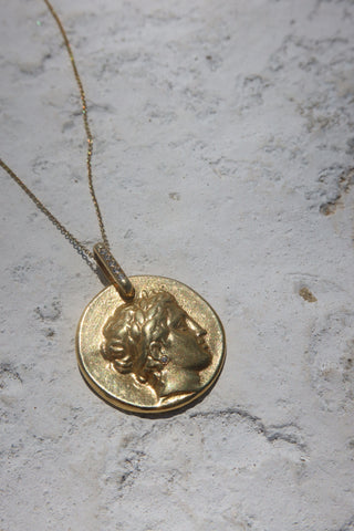 Gold coin necklace featuring the Greek God Apollo with a gemstone earring and gold chain necklace - jewelry made in Greece.