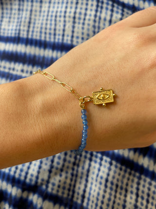 Gold and blue agate gemstone evil eye charm bracelet made in Greece by Barbora Jewelry