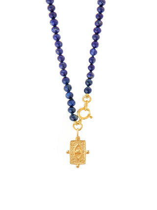 Lapis gemstone and gold-plated evil eye charm necklace made in Greece by Barbora Jewelry, a Greek jewelry designer.
