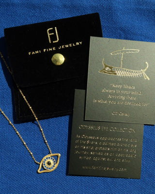 Gold plated necklace with an eye-shaped pendant on a person's neck - Greek evil eye jewelry made in Greece made with sterling silver 925 in the design of Homer's Odyssey eye on odysseus's ship