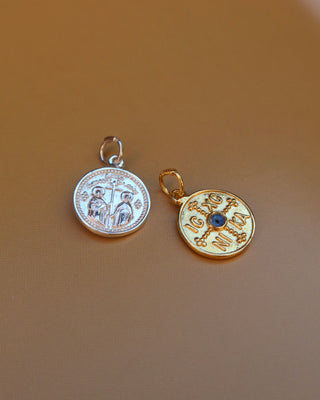 Silver and gold round pendants with Saints Constantine and Helen and IC XC NI KA with evil eye mati on the other side made in Greece, Greek Orthodox religion pendants