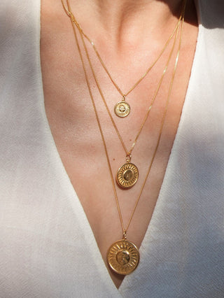 Gold-plated silver 925 sun charm necklace made in Greece by Barbora Jewelry, a Greek jewelry designer.