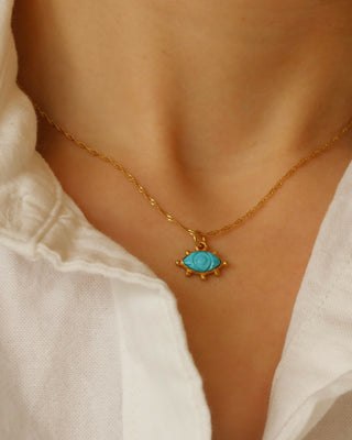 Carved turquoise evil eye pendant necklace on a twisted gold-plated sterling silver 925 handmade in Greece. Greek protection jewelry with gemstones