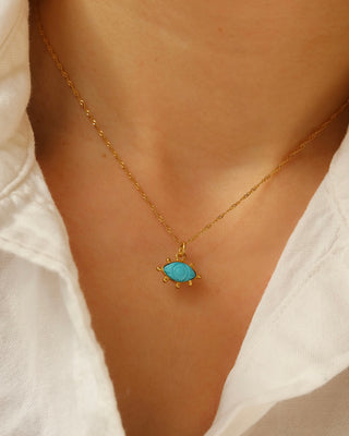 Carved turquoise evil eye pendant necklace on a twisted gold-plated sterling silver 925 handmade in Greece. Greek protection jewelry with gemstones