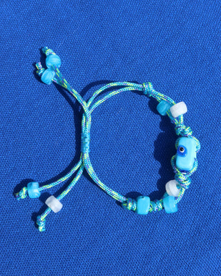 Turquoise blue adjustable woven rope bracelet with blue evil eye beads made in Greece