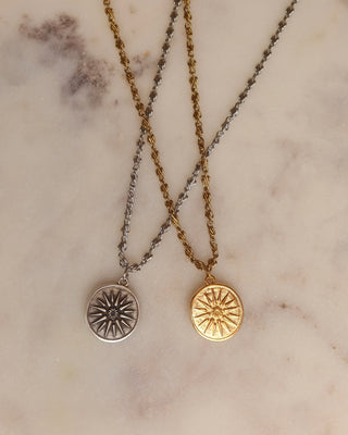 A gold and a silver coin necklace with sun symbols, ancient Greek coin necklaces