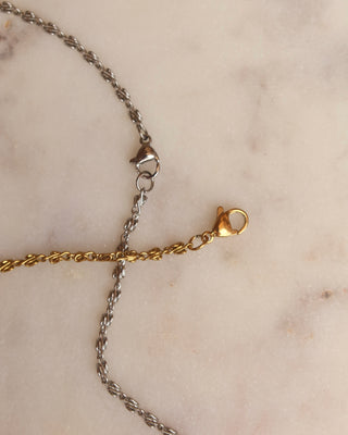 close up of infinity chain silver and gold necklaces with lobster claw clasps