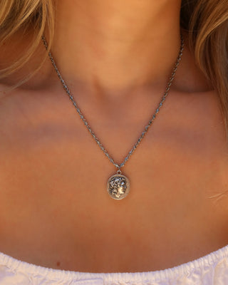 Woman wearing a silver Alexander the Great Greek coin necklace on an infinity chain, Greek coin jewelry