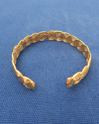 Gold cuff braceletswith a braided wave design made in Greece, Greek jewelry