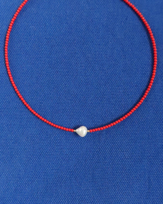 Red coral beaded necklace with a freshwater pearl at the center. Handmade in Greece, Greek jewelry