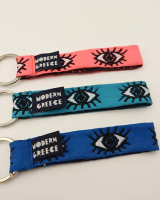 3 evil eye woven lanyard key rings in coral, turquoise, and blue made in Greece. Greek evil eye keychain wrist strap