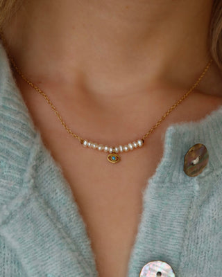 gold-plated sterling silver 925 necklace with an evil eye charm with a turquoise accent and freshwater pearls handmade in Greece. Greek evil eye jewelry