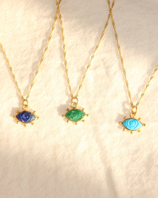 lapis lazuli carved evil eye necklace, adventurine green evil eye necklace, and a carved turquoise evil eye necklace all on gold-plated twisted Singapore chains made in Greece. Greek protection eye jewelry