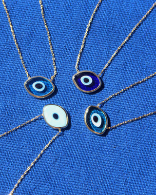 Murano glass evil eye necklaces made in Greece. Greek mati necklaces in light blue, dark blue, turquoise and green