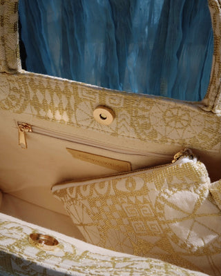 Interior of a gold metallic woven tote bag. Large cotton artisan made handbag made in greece