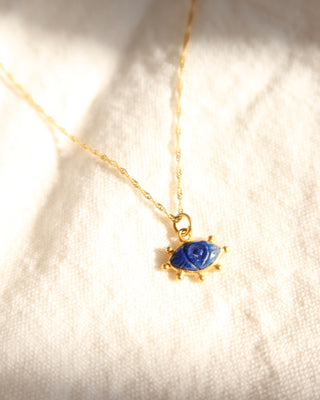 Gold-plated sterling silver 925 necklace with a lapis lazuli gemstone evil eye pendant on a twisted Singapore chain made in Greece. Greek handmade jewelry