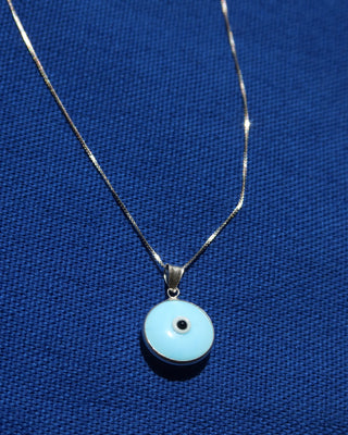 sterling silver 925 necklace with a light blue glass evil eye round pendant made in Greece. Greek evil eye necklace on a silver chain