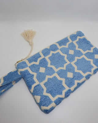 Blue and cream printed woven wristlet clutch bag made in Greece. Emily in Paris bag brand in Mykonos, Marabu clutch bag cotton