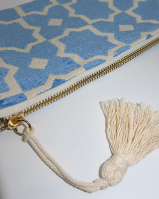 Blue and cream geometric printed woven wristlet clutch bag made in Greece. Emily in Paris bag brand in Mykonos, Marabu clutch bag cotton with tassel zipper