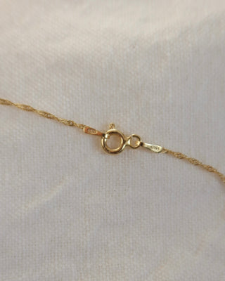 spring ring clasp on twisted Singapore chain that is gold-plated sterling silver 925