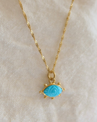 Carved turquoise evil eye pendant necklace on a twisted gold-plated sterling silver 925 handmade in Greece. Greek protection jewelry with gemstones