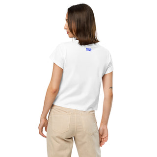 Woman wearing a white short-sleeve t-shirt with a blue Aegean Essence logo under the collar on the back